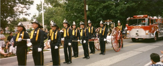 Members of the fire department. Bedford Village Parade.  July 1998.